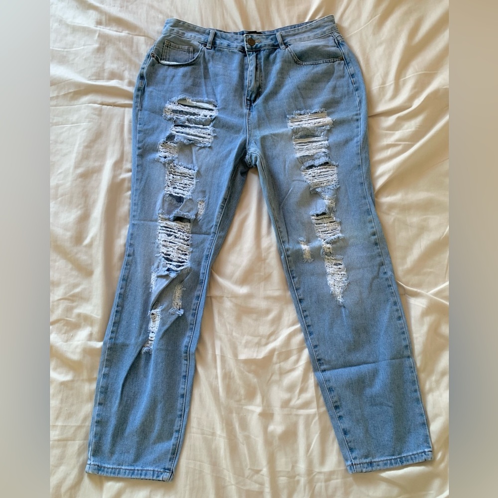 Forever 21+ Medium-Washed Distressed Jeans:
• Color: Light Blue
• Size: 12